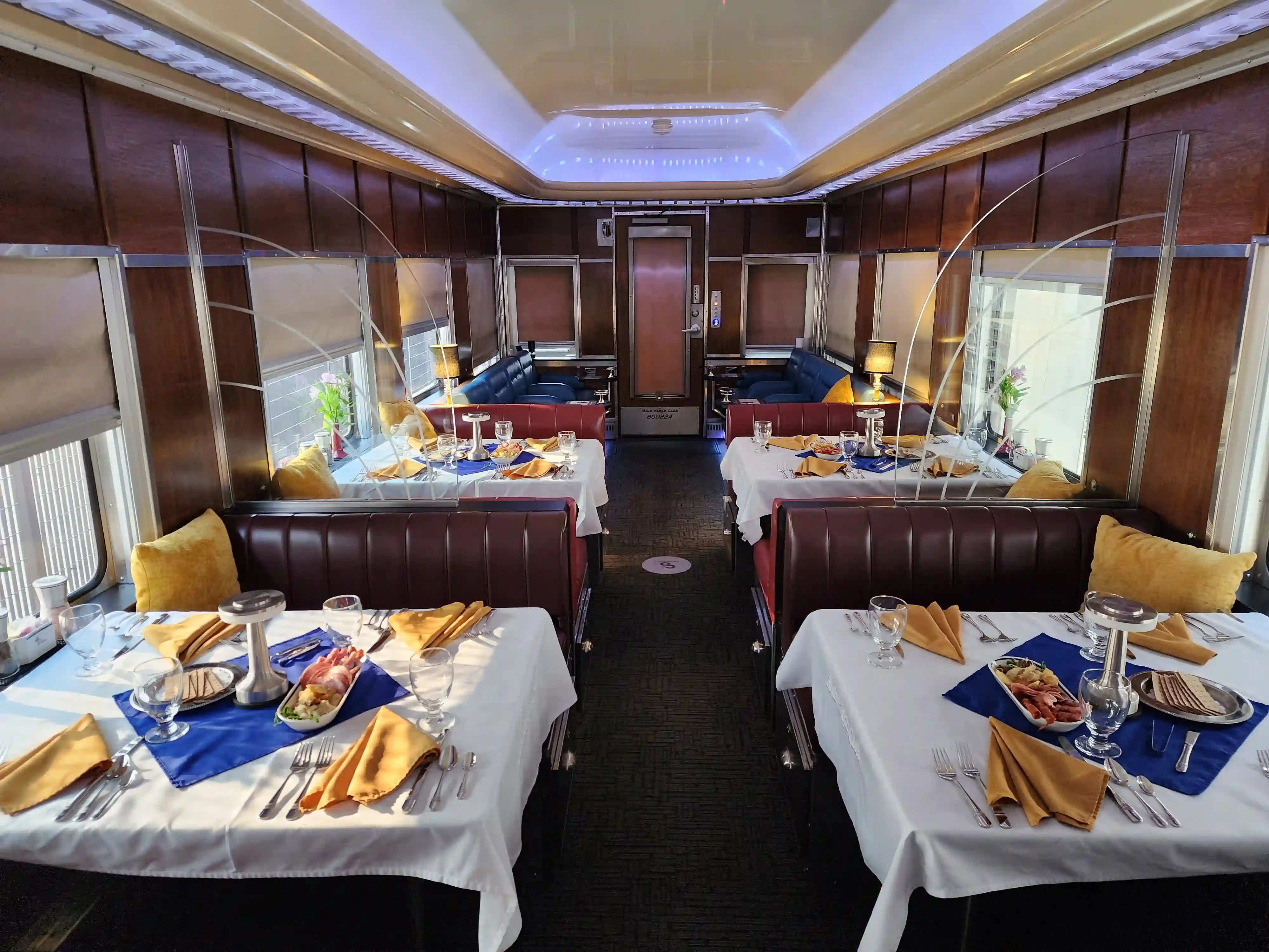 A photograph of a private railcar interior dining room
